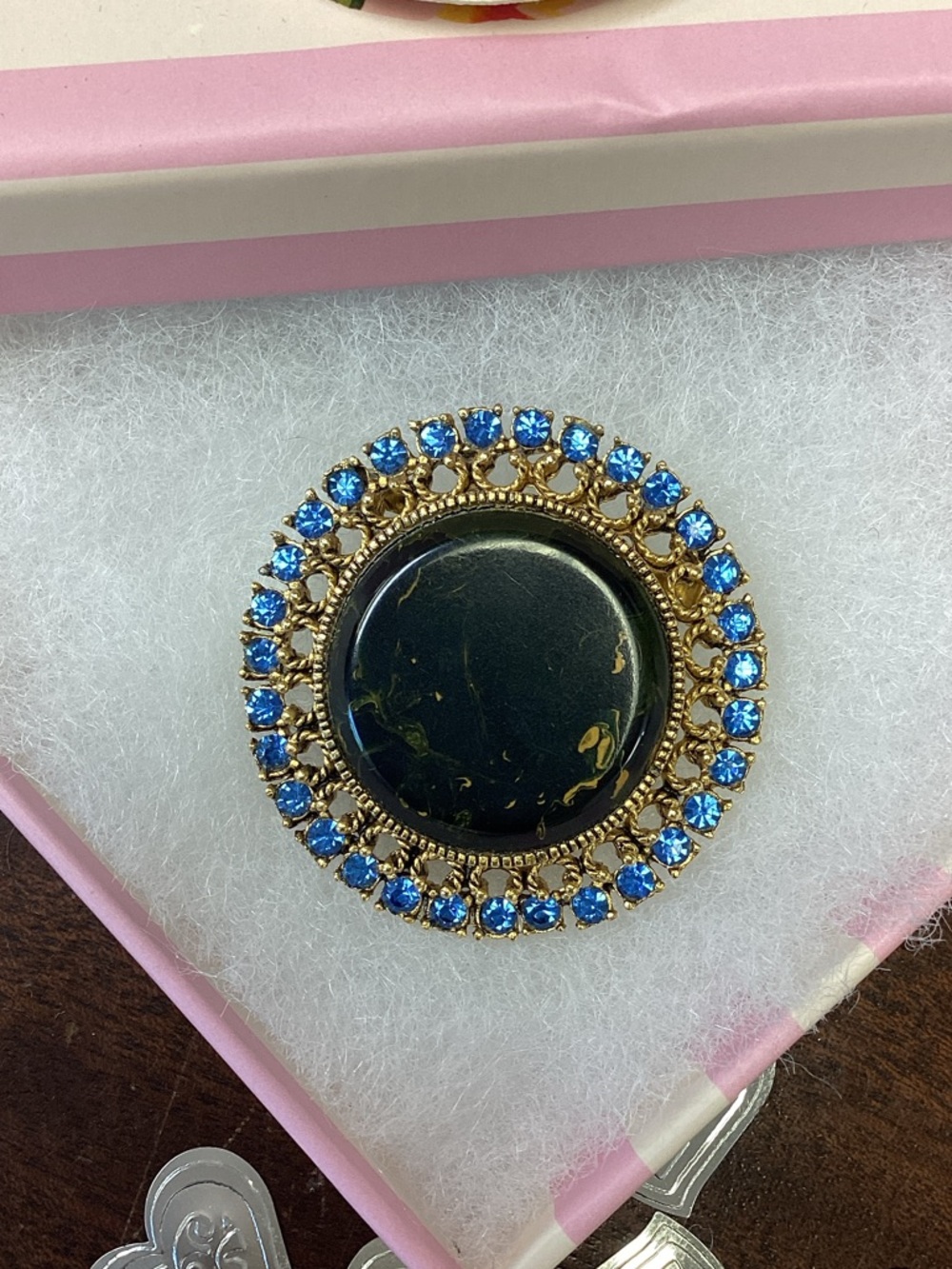 Vintage costume, jewelry pin with natural element at its center